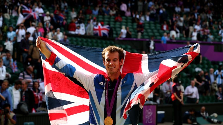 Gold medalist Andy Murray celebrates during the medal ceremony at the 2012 Olympic Games in London