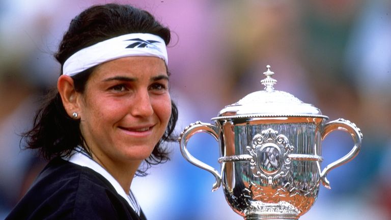 Arantxa Sanchez Vicario of Spain lifts the trophy after winning the French Open at Roland Garros