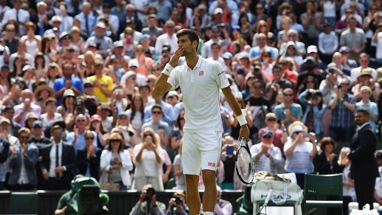 Novak Djokovic celebrates victory following the Men's Singles first round match against James Ward