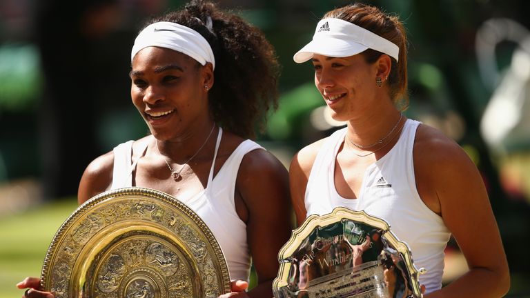 Serena Williams of the United States holds the Venus Rosewater Dish next to Garbine Muguruza