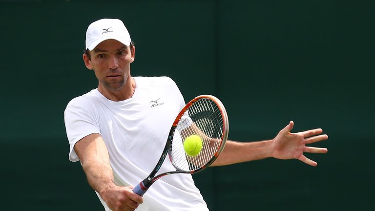 Ivo Karlovic plays a backhand shot during the Men's Singles first round match against Borna Coric