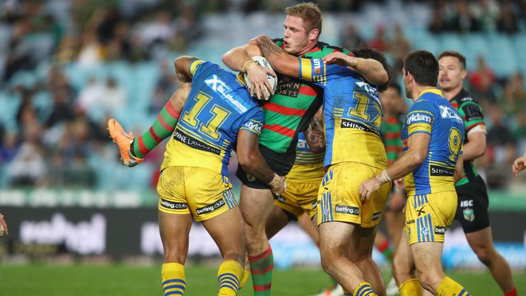 Thomas Burgess of the Rabbitohs is wrapped up by the Parramatta Eels defence