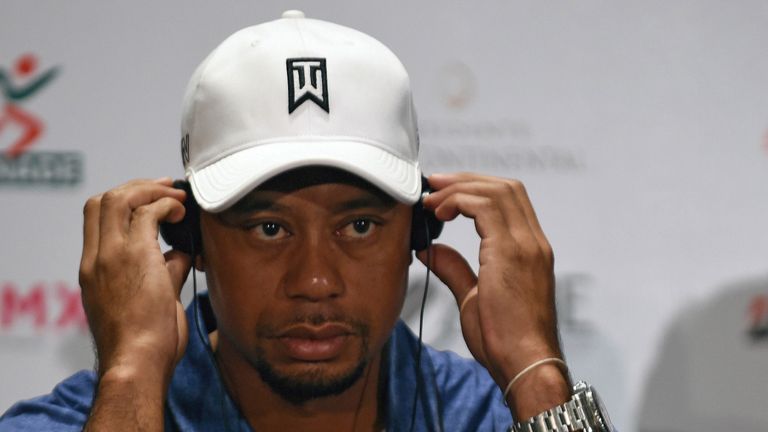 Tigers Woods listens during a press conference