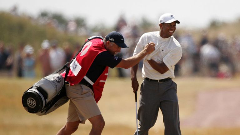 HOYLAKE, UNITED KINGDOM - JULY 21: Tiger Woods of USA celebrates holing his approach shot on the 14th hole for an eagle, with caddy Steve Williams during t