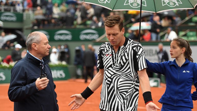 PARIS, FRANCE - JUNE 02:  Tomas Berdych of Czech Republic consults with the match officials regarding the weather conditions during the Men's Singles quart