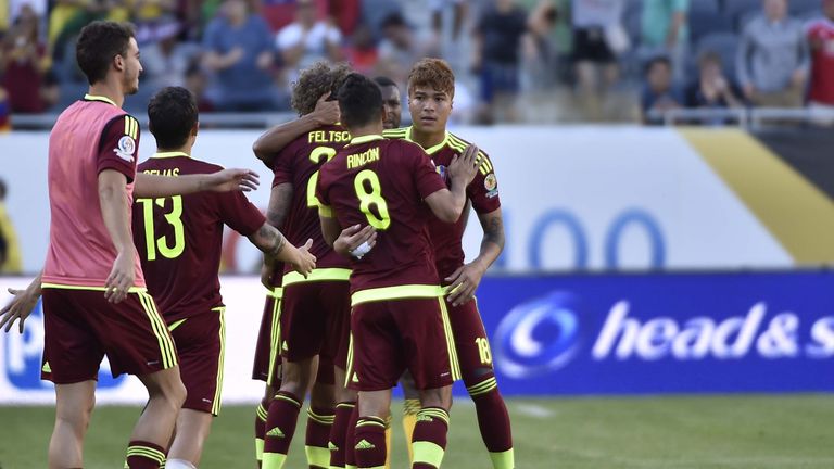 Players of Venezuela celebrate after defeating Jamaica