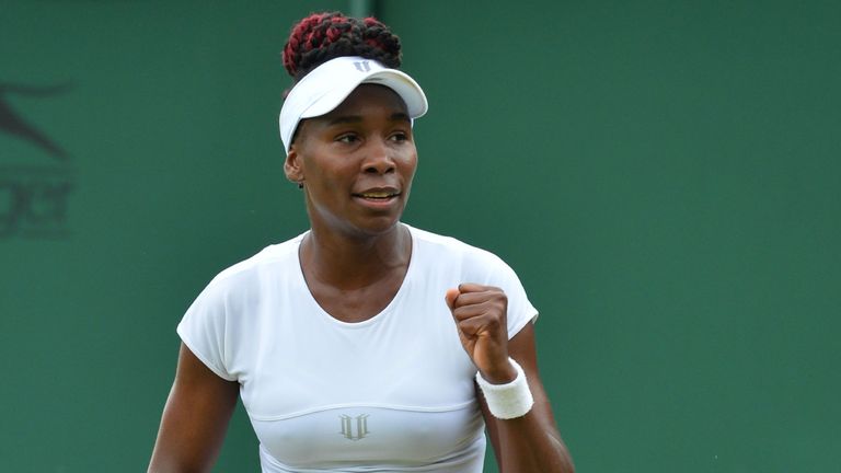 US player Venus Williams celebrates beating Greece's Maria Sakkari during their women's singles second round match on the fourth day of the 2016 Wimbledon 