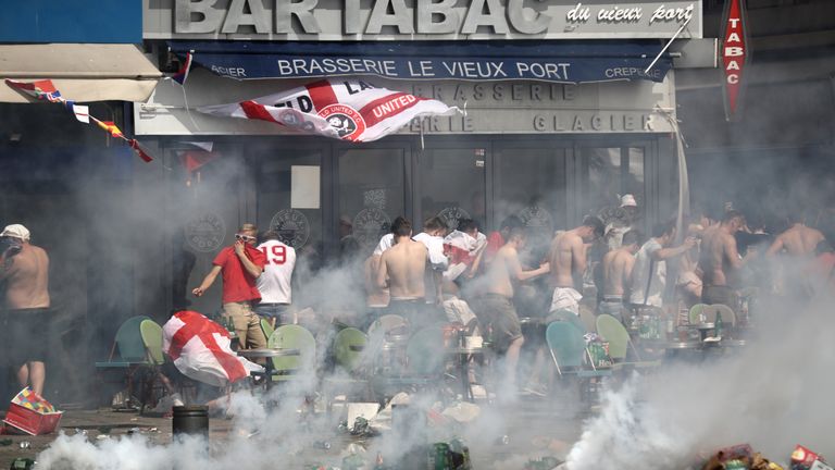 England fans react after police sprayed tear gas in Marseille