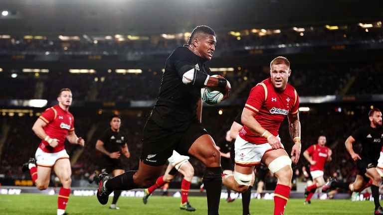 Waisake Naholo of New Zealand makes a break against Ross Moriarty 