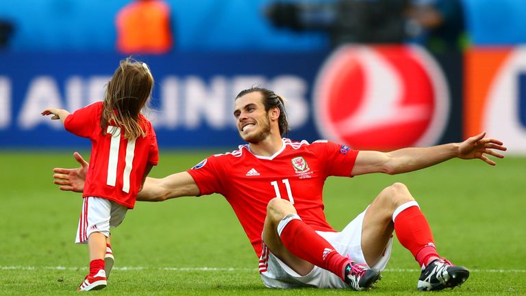 Gareth Bale celebrates Wales win with his daughter