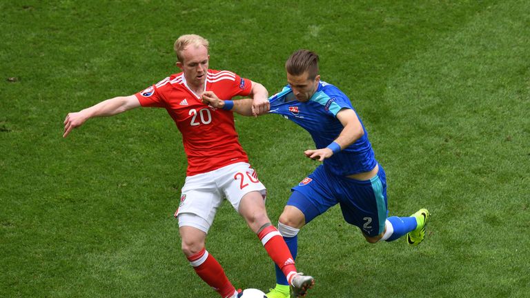 BORDEAUX, FRANCE - JUNE 11:  Jonathan Williams of Wales and Peter Pekarik of Slovakia compete for the ball during the UEFA EURO 2016 Group B match between 