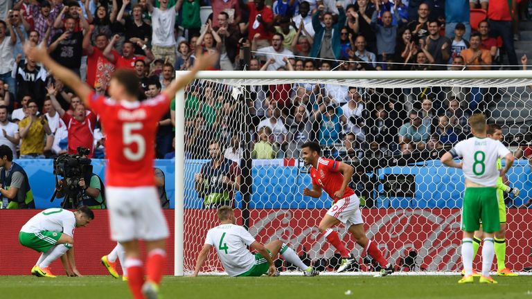 Wales celebrate Gareth McAuley's own goal