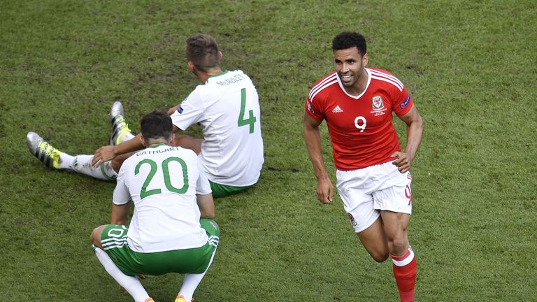Wales' forward Hal Robson-Kanu (R) celebrates after an own goal by Northern Ireland's defender Gareth McAuley (C) during the Euro 2016 round of sixteen foo