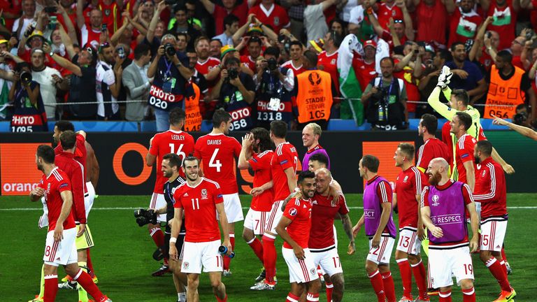 Wales players celebrate their team's 3-0 win