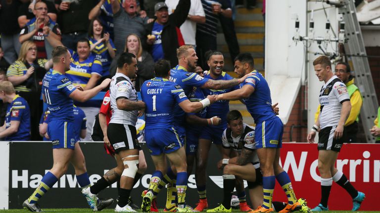 Warrington Wolves' Gene Ormsby celebrates scoring the game's first try