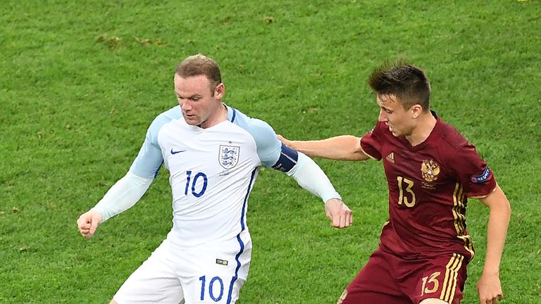 England's forward Wayne Rooney (L) vies with Russia's midfielder Aleksandr Golovin during the Euro 2016 group B football match between England and Russia a