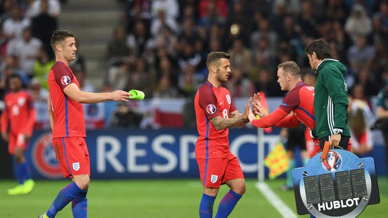 England's forward Wayne Rooney (R) comes on for England's midfielder Jack Wilshere (C)