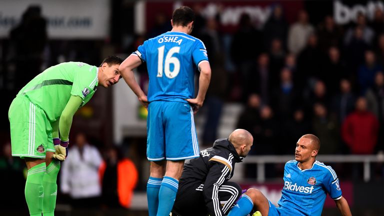 LONDON, ENGLAND - MARCH 21:  Wes Brown of Sunderland receives treatment before leaving the pitch injured during the Barclays Premier League match between W