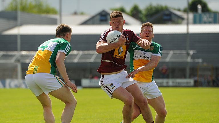 John Heslin of Westmeath in action against Sean Pender, left, and Brian Darby, right, of Offaly