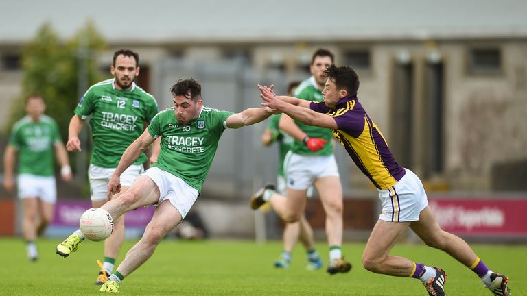 Barry Mulrone of Fermanagh in action against Eoghan Nolan of Wexford  at Innovate Wexford Park in Wexford.