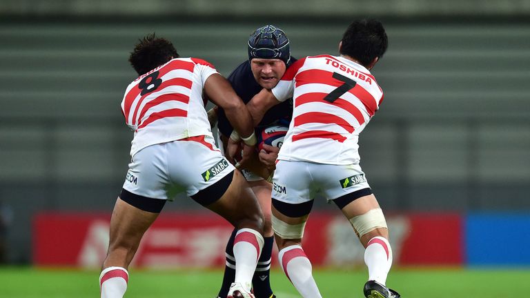Scotland's WP Nel charges into two Japanese players