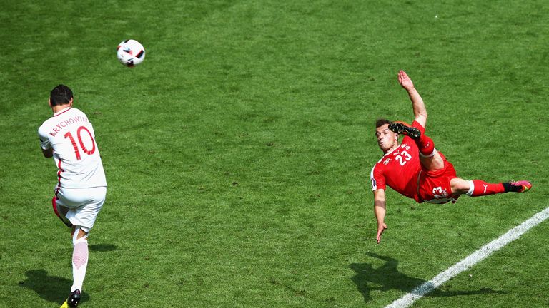 Xherdan Shaqiri scores a stunning equaliser for Switzerland in the last-16 clash with Poland