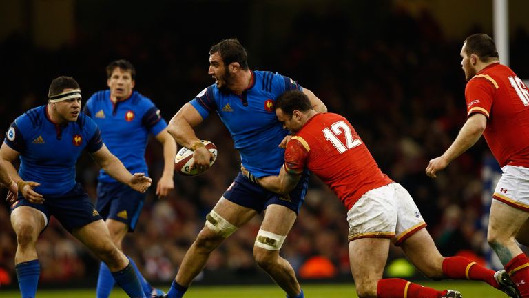 CARDIFF, WALES - FEBRUARY 26:  Yoann Maestri of France offloads as he is tack;led by Jamie Roberts of Wales during the RBS Six Nations match between Wales 