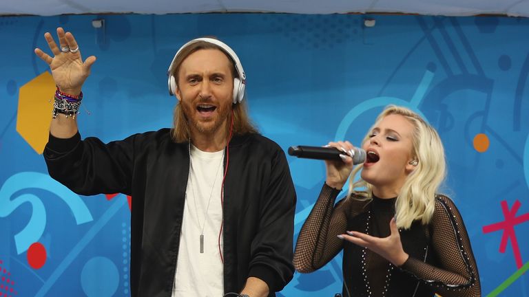 Singer Zara Larsson and DJ David Guetta perform during the opening ceremony
