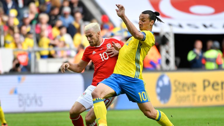 Aaron Ramsey of Wales and Zlatan Ibrahimovic of Sweden battle for the ball