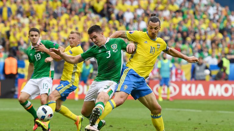 Zlatan Ibrahimovic of Sweden and Ciaran Clark of Republic of Ireland compete for the ball 