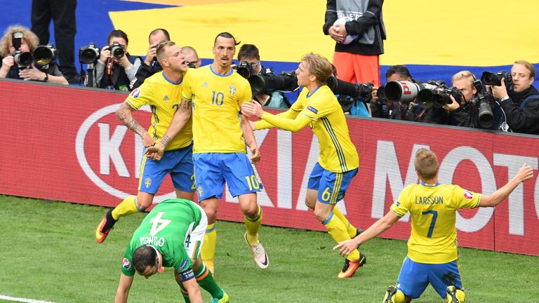 Sweden's forward Zlatan Ibrahimovic (top 2nd L) celebrates a goal with teammates during the Euro 2016 group E football match v Republic of Ireland