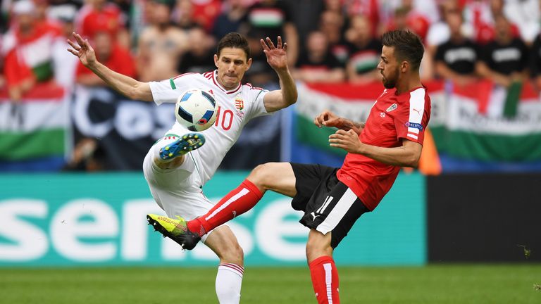 Zoltan Gera of Hungary and Martin Harnik of Austria compete for the ball during the UEFA EURO 2016 Group F match in Bordeaux
