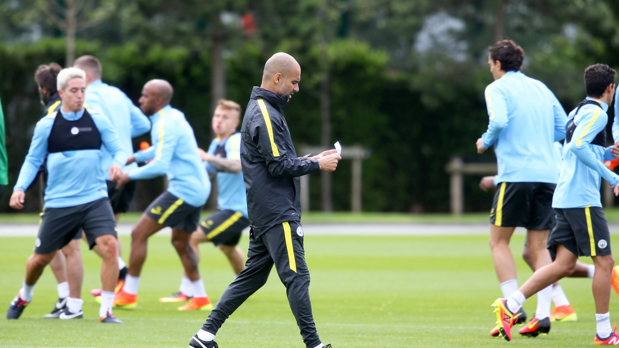 Manchester City boss Pep Guardiola takes first training session ...