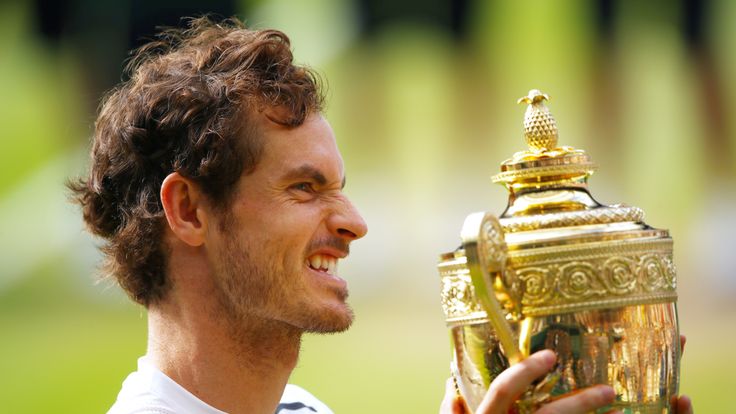 LONDON, ENGLAND - JULY 10:  Andy Murray of Great Britain lifts the trophy following victory in the Men's Singles Final against Milos Raonic of Canada on da