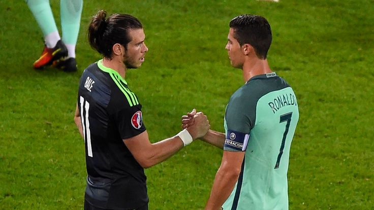 Portugal's forward Cristiano Ronaldo (R) shakes hands with Wales' forward Gareth Bale 