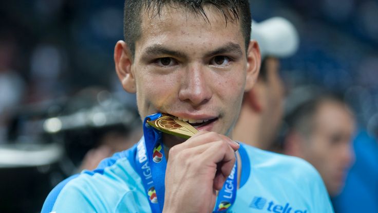 Hirving Lozano celebrates with his medal after winning the title