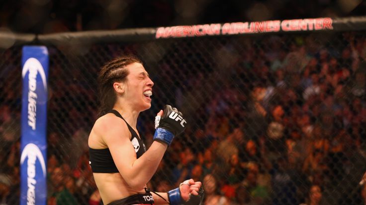 DALLAS, TX - MARCH 14:  Joanna Jedrzejczyk celebrates her TKO against Carla Esparza in the Women's Strawweight bout during the UFC 185 event at American Ai