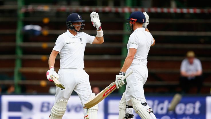 Joe Root of England is congratulated by Jonny Bairstow of England after he scored a century