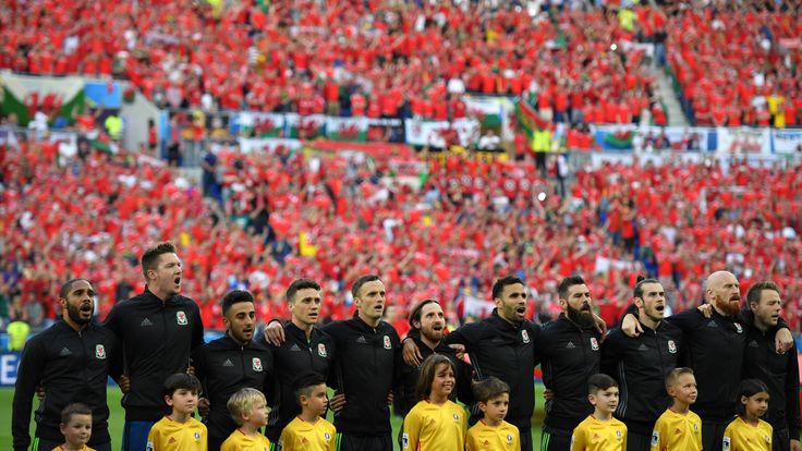 LYON, FRANCE - JULY 06:  Wales players sing the national anthem before the UEFA EURO 2016 semi final match between Portugal and Wales at Stade des Lumieres