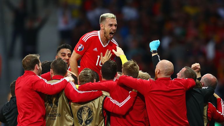 LILLE, FRANCE - JULY 01:  Aaron Ramsey (top) and Wales players celebrate their team's first goal by Ashley Williams (obscured) during the UEFA EURO 2016 qu