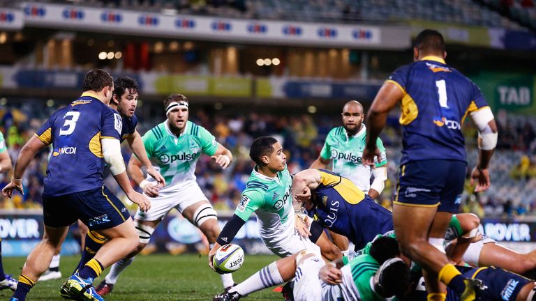  Aaron Smith  looks to offload the ball 