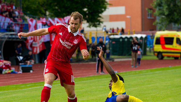 Aberdeen's Niall McGinn (left) evades a tackle against FK Ventspils in their EUROPA LEAGUE 2nd QUALIFYING ROUND, 2nd leg