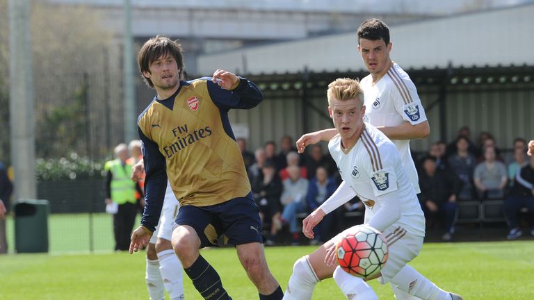 Adam King contests the ball with Tomas Rosicky of Arsenal in an Under-21s game last season