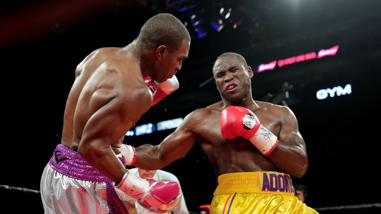 Adonis Stevenson rocks Thomas Williams with a body shot during their WBC light heavyweight title contest in Quebec City