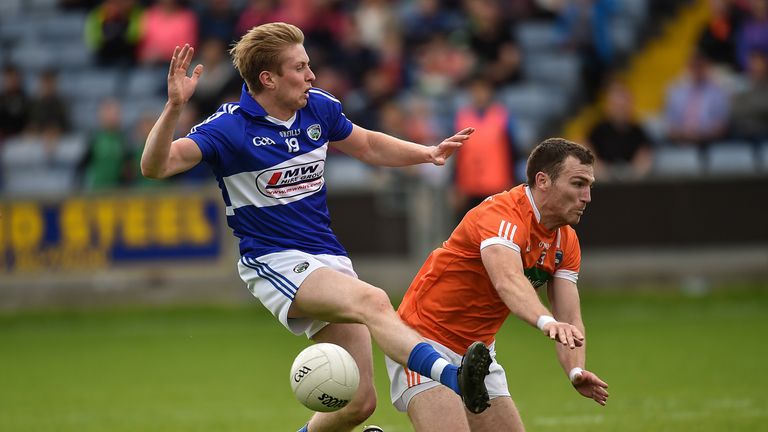 Alan Farrell's shot is blocked by Brendan Donaghy of Armagh