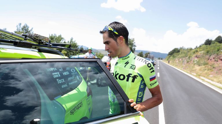 Spain's Alberto Contador gets in his team car after dropping out of the 184,5 km ninth stage of the 103rd edition of the Tour de France cycling race on Jul