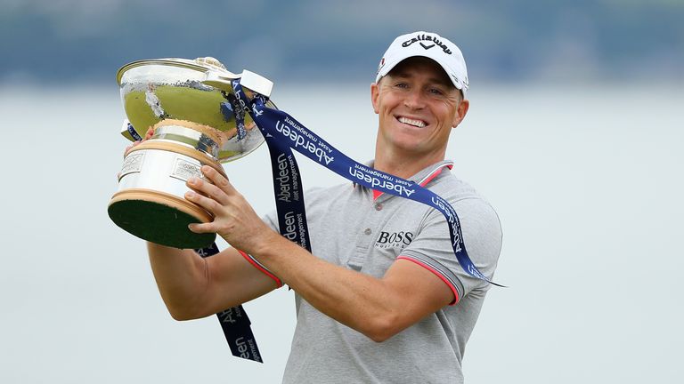 Alex Noren poses with the Scottish Open trophy