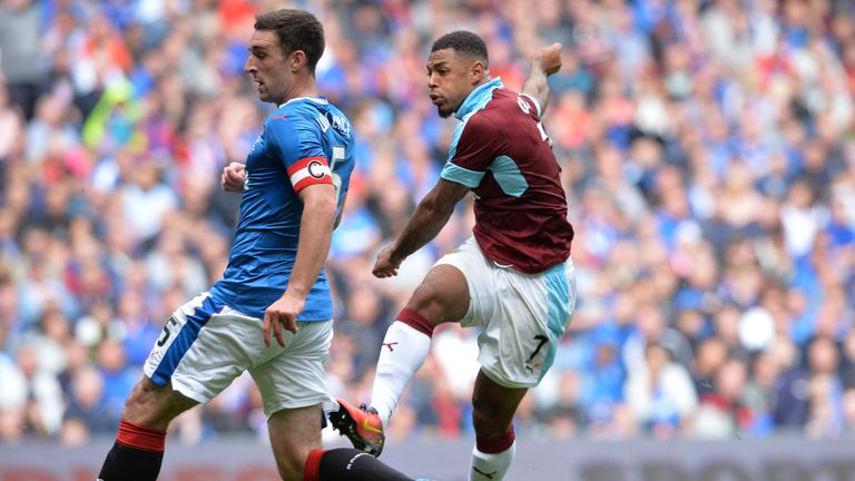 Andre Gray of Burnley hammers in his third goal against Rangers
