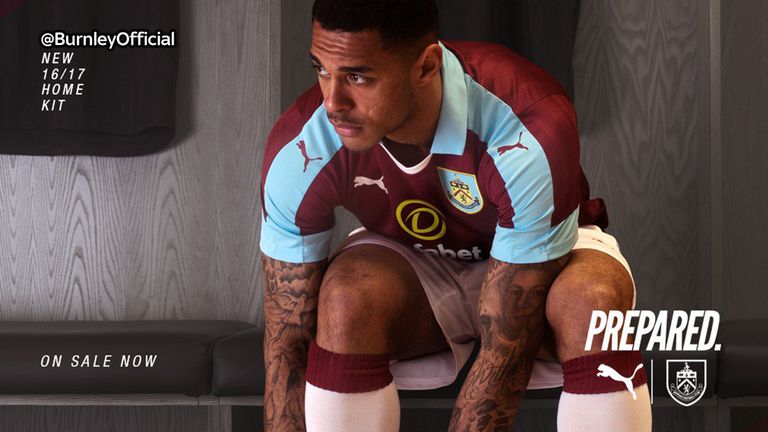 Andre Gray models Burnley's new home kit ahead of their return to the Premier League