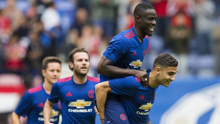 Manchester United's Belgian midfielder Andreas Pereira (R) celebrates with Manchester United's Ivorian midfielder Eric Bailly (2R) and Manchester United's 
